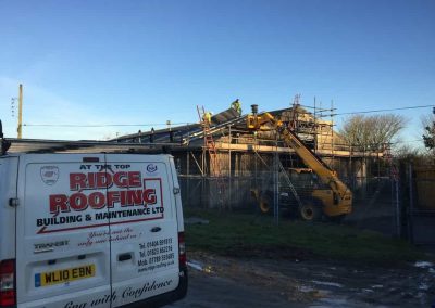 Loading out the new sheets onto the roof