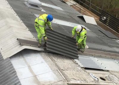 Laying the new sheets on the roof