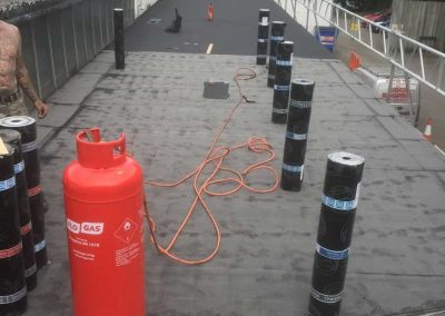 Laying the cap sheet