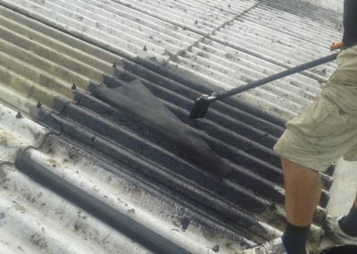 Applying the hessian scrim to the first coat on the roof, another coat will be applied on the top