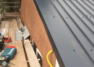 Boxed profile industrial roofFitting the verge trims on box profile sheet job