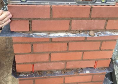 Second lead tray being installed on roof before dressing