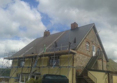 Applying a 3 layer system, 1st coat weather seal, 2nd hessian, weather seal 3rd coat